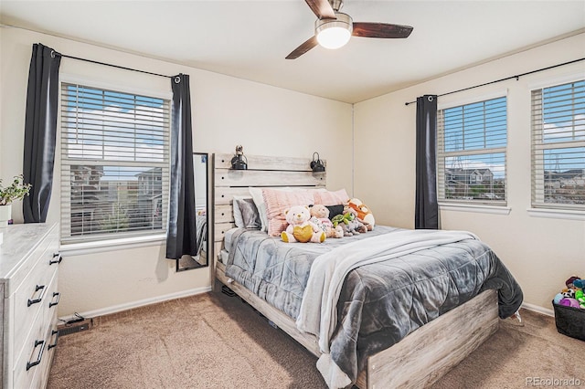 26385 E Canal Pl, Aurora, CO 80018 - carpeted bedroom featuring baseboards, multiple windows, and ceiling fan