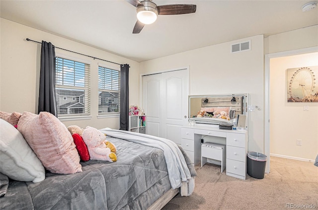 26385 E Canal Pl, Aurora, CO 80018 - bedroom with light carpet, a closet, baseboards, and a ceiling fan