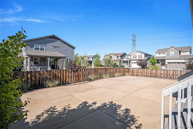 26385 E Canal Pl, Aurora, CO 80018 - view of patio / terrace featuring fence, a residential view, and covered porch