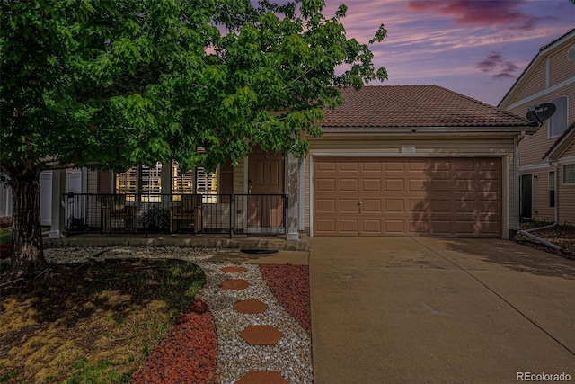 19481 E 50th Pl, Denver, CO 80249 - view of front facade featuring an attached garage, driveway, and a tiled roof