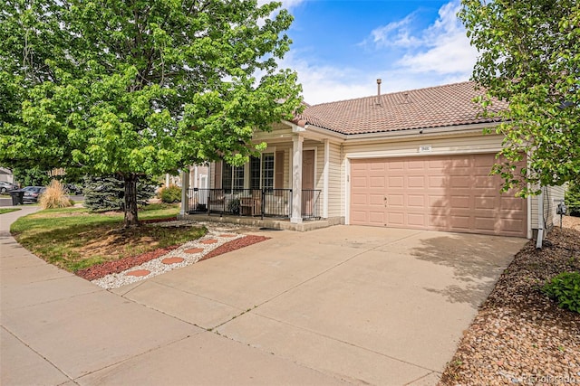 19481 E 50th Pl, Denver, CO 80249 - view of front facade with a porch, an attached garage, concrete driveway, and a tiled roof