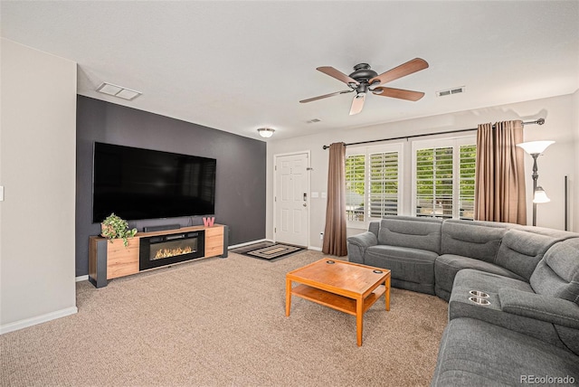 19481 E 50th Pl, Denver, CO 80249 - living area featuring a ceiling fan, baseboards, carpet floors, and a glass covered fireplace