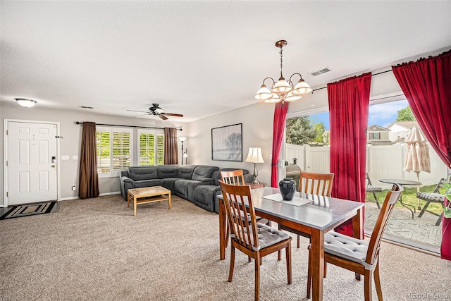 19481 E 50th Pl, Denver, CO 80249 - dining area featuring carpet floors, a chandelier, a ceiling fan, and baseboards