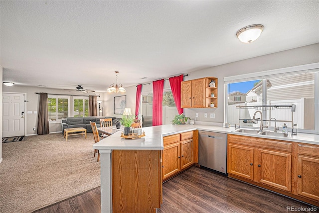 19481 E 50th Pl, Denver, CO 80249 - kitchen with dishwasher, a peninsula, a sink, open floor plan, and a textured ceiling
