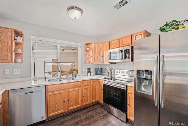 19481 E 50th Pl, Denver, CO 80249 - kitchen featuring appliances with stainless steel finishes, open shelves, a sink, dark wood-type flooring, and light countertops