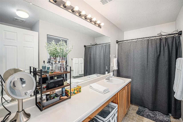 19481 E 50th Pl, Denver, CO 80249 - full bath featuring a textured ceiling, vanity, and a shower with shower curtain