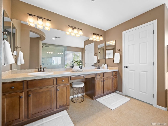 bathroom with a stall shower and double vanity