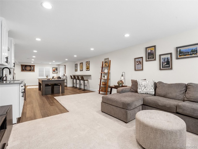 living room with recessed lighting, wood finished floors, and baseboards