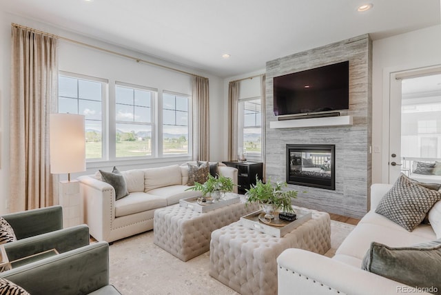 2141 Fountain Cir, Erie, CO 80516 - living room with a multi sided fireplace, recessed lighting, and wood finished floors