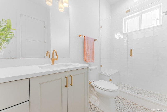 2141 Fountain Cir, Erie, CO 80516 - bathroom with toilet, a shower stall, vanity, and tile patterned floors