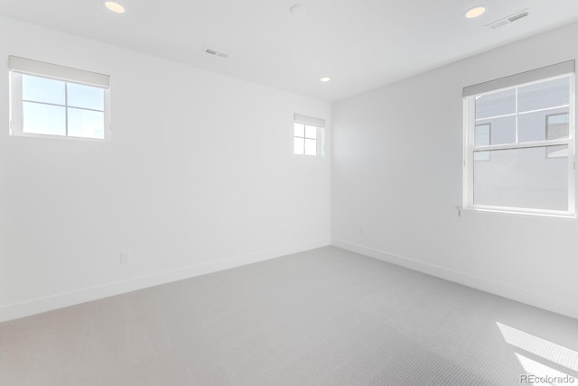 2141 Fountain Cir, Erie, CO 80516 - carpeted empty room featuring plenty of natural light, recessed lighting, and baseboards