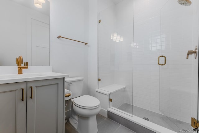 2141 Fountain Cir, Erie, CO 80516 - full bath featuring a stall shower, toilet, vanity, and tile patterned flooring