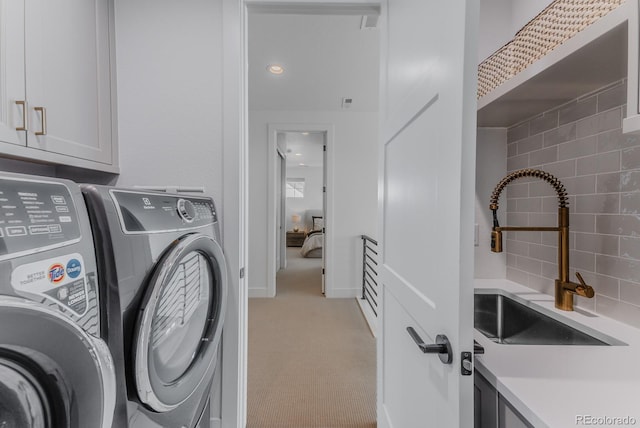 2141 Fountain Cir, Erie, CO 80516 - washroom featuring cabinet space, independent washer and dryer, and light colored carpet