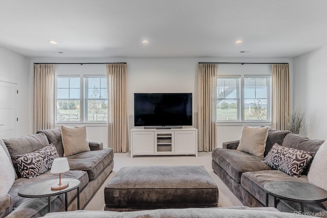 2141 Fountain Cir, Erie, CO 80516 - living area featuring plenty of natural light, recessed lighting, and light carpet