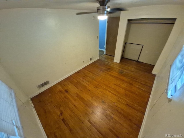 1078 Elmira St, Aurora, CO 80010 - unfurnished bedroom with wood finished floors, baseboards, and a ceiling fan