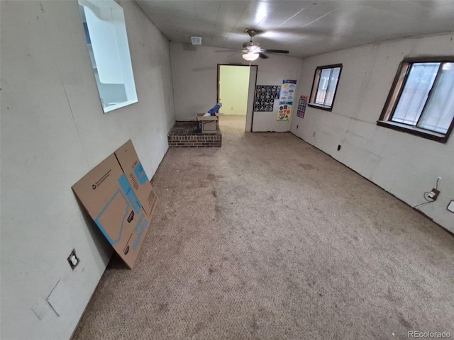 1078 Elmira St, Aurora, CO 80010 - unfurnished living room with a ceiling fan and carpet floors