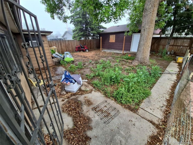 1078 Elmira St, Aurora, CO 80010 - fenced backyard with an outbuilding