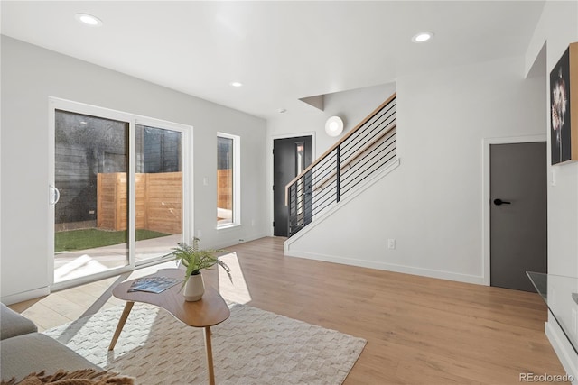 living room with a healthy amount of sunlight and light wood-type flooring