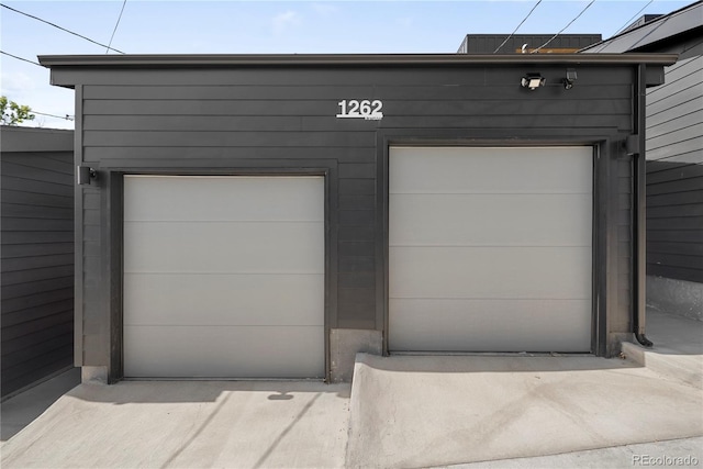 garage featuring wooden walls