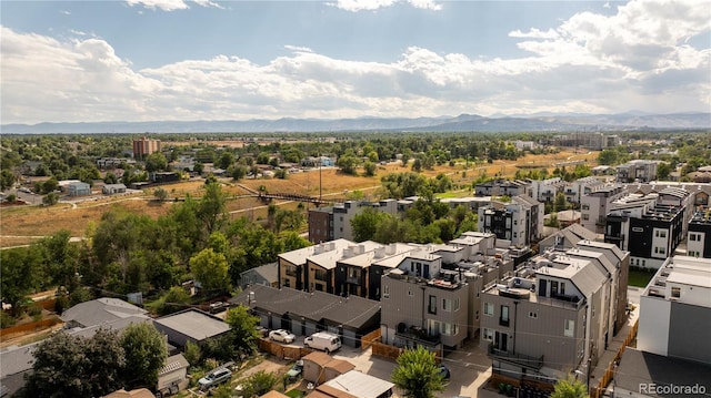 birds eye view of property with a mountain view