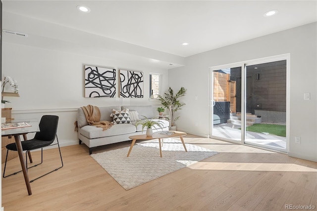1262 N Stuart St Unit 2, Denver, CO 80204 - living room with light wood-style floors, recessed lighting, and baseboards