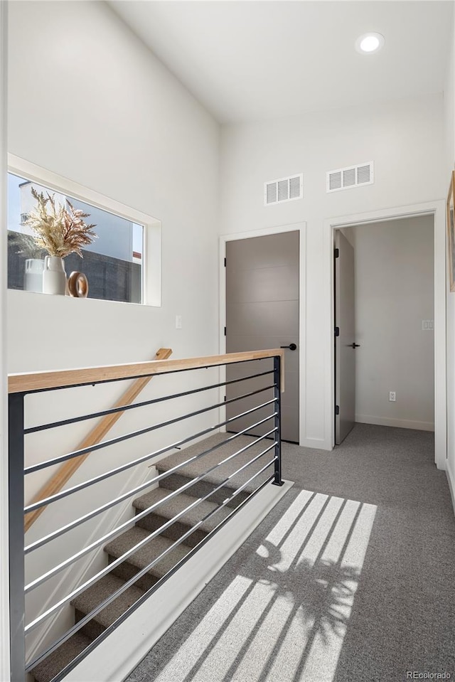 empty room with recessed lighting, visible vents, carpet floors, and baseboards