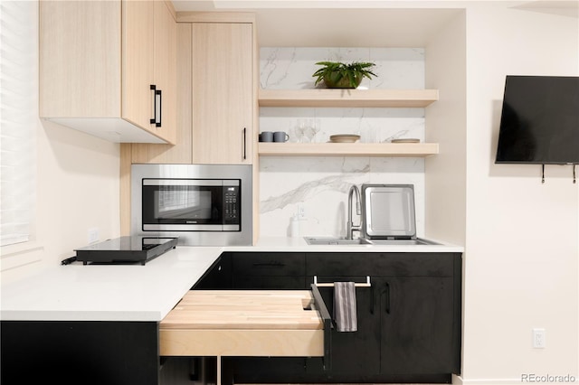 1262 N Stuart St Unit 2, Denver, CO 80204 - bar featuring stainless steel microwave, backsplash, and a sink
