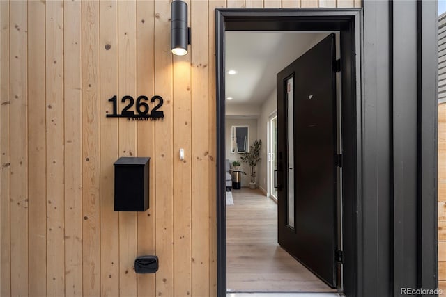 1262 N Stuart St Unit 2, Denver, CO 80204 - corridor featuring wooden walls, light wood-style flooring, and recessed lighting