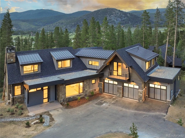 view of front facade with a balcony and a mountain view