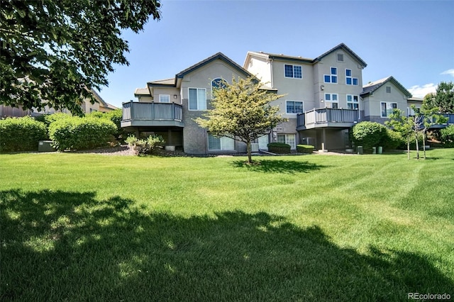 3325 W 111th Loop Unit C, Westminster, CO 80031 - back of property with a lawn and stucco siding