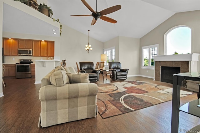 3325 W 111th Loop Unit C, Westminster, CO 80031 - living area with high vaulted ceiling, ceiling fan, a chandelier, dark wood-style floors, and a tile fireplace