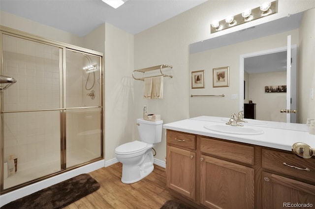 3325 W 111th Loop Unit C, Westminster, CO 80031 - full bathroom featuring vanity, a shower stall, and wood finished floors