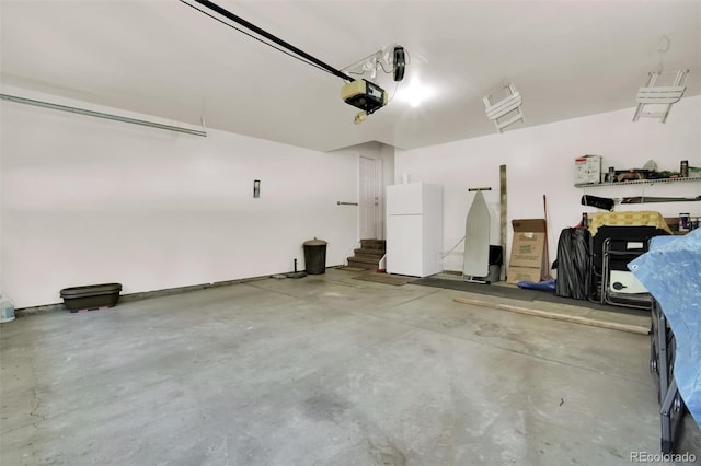 3325 W 111th Loop Unit C, Westminster, CO 80031 - garage featuring freestanding refrigerator and a garage door opener