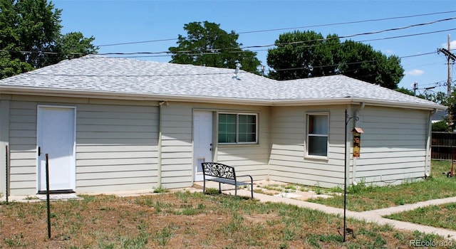 933 Skeel St, Brighton, CO 80601 - view of front facade featuring roof with shingles