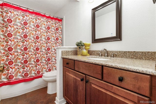 full bathroom with shower / bathtub combination with curtain, vanity, and toilet