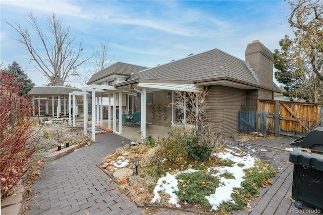 rear view of property featuring a patio