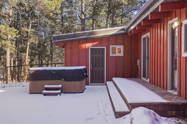 exterior space with a hot tub