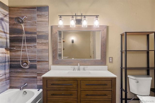 full bathroom with vanity, toilet, and tiled shower / bath