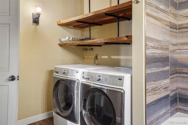 clothes washing area featuring independent washer and dryer