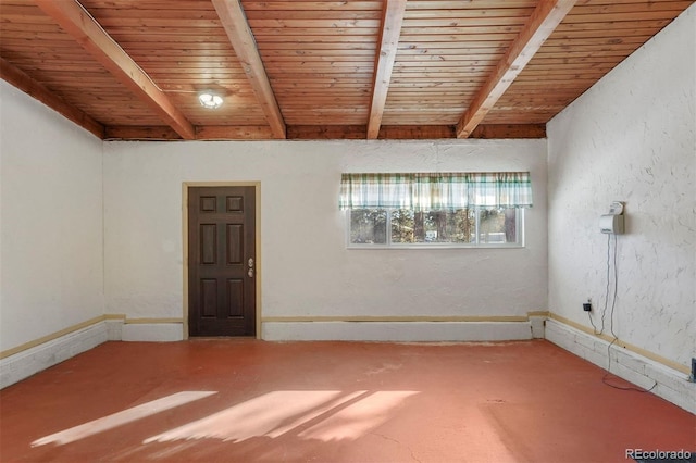 unfurnished room with beam ceiling and wood ceiling