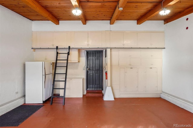 interior space with white refrigerator and wood ceiling