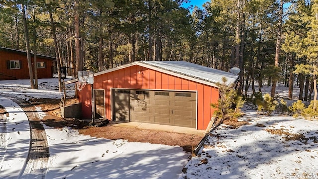 view of snow covered garage