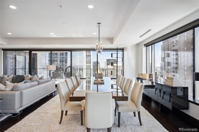 dining space featuring plenty of natural light and hardwood / wood-style flooring