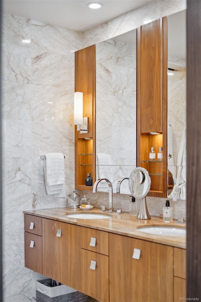 bathroom featuring tile walls, backsplash, and vanity