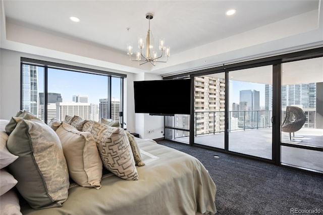 carpeted bedroom with a chandelier and access to exterior