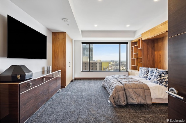 bedroom with dark colored carpet