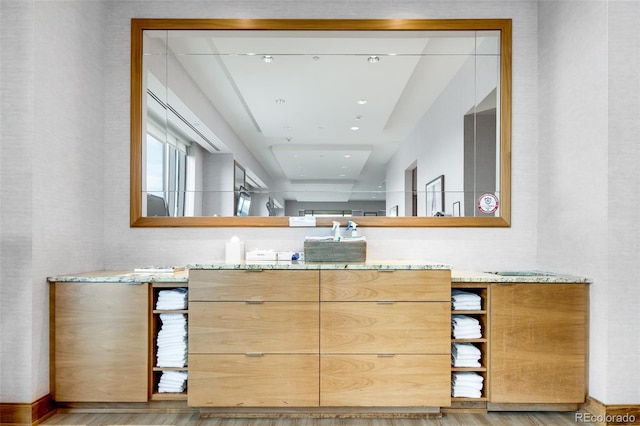 bathroom featuring vanity and hardwood / wood-style floors