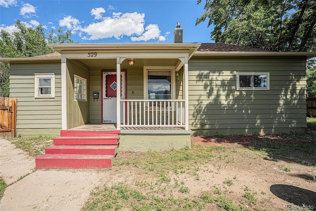 529 S Prospect St, Colorado Springs, CO 80903 - view of front of home featuring a chimney and a porch