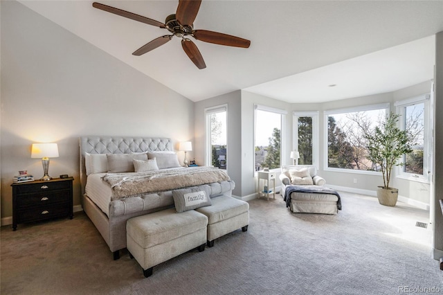 bedroom featuring carpet floors, baseboards, vaulted ceiling, and a ceiling fan