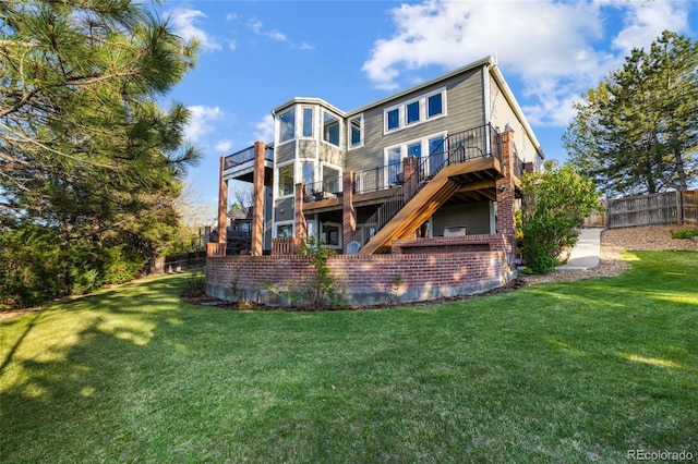 rear view of house with a wooden deck and brick siding